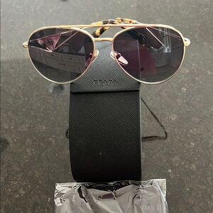 Brand New Prada Gold and Black Aviator Sunglasses with Sleek Design